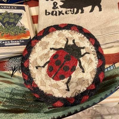 LOT 73: Large Vintage Home Decor Collection - Longaberger Handmade Basket, Wooden Spools, Lillian Vernon Americana Serving Plate and Much...