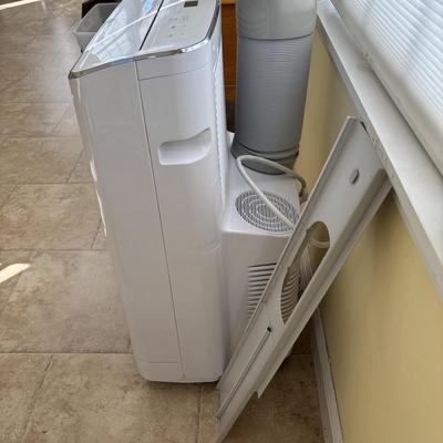 LOT 93: GE Portable Air Conditioner Model APWA14YBMWW1