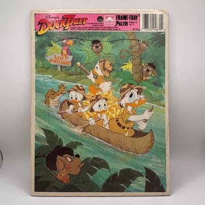 LOT 220: Master of the Universe Snout Spout (NIP), Smokey the Bear & Duck Tale Cardboard Puzzles and a Little Blue Friend Baker Smurf