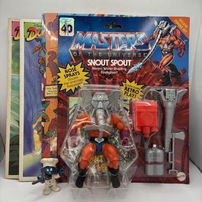 LOT 220: Master of the Universe Snout Spout (NIP), Smokey the Bear & Duck Tale Cardboard Puzzles and a Little Blue Friend Baker Smurf