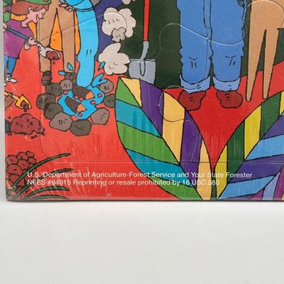 LOT 220: Master of the Universe Snout Spout (NIP), Smokey the Bear & Duck Tale Cardboard Puzzles and a Little Blue Friend Baker Smurf