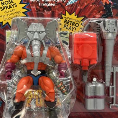 LOT 220: Master of the Universe Snout Spout (NIP), Smokey the Bear & Duck Tale Cardboard Puzzles and a Little Blue Friend Baker Smurf