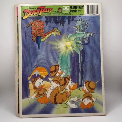 LOT 220: Master of the Universe Snout Spout (NIP), Smokey the Bear & Duck Tale Cardboard Puzzles and a Little Blue Friend Baker Smurf