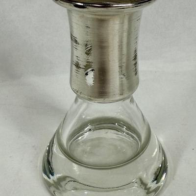 Sale Photo Thumbnail #85: Set of 4, excellent condition.  Elegant Kosta Boda candle holders. Features a silvered top and clear glass base. Made in Sweden. Approx. 4" tall.