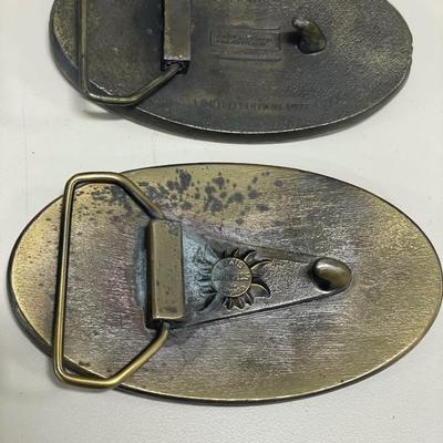 Vintage belt buckles and train whistle