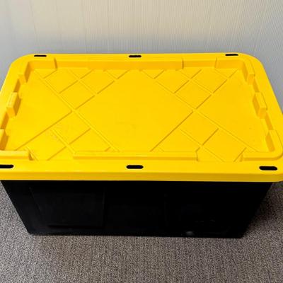 Sale Photo Thumbnail #324: Black bins with yellow lids. Measures 30” x 20” x 14” deep. Stackable. Near new condition.