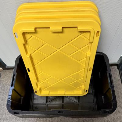 Sale Photo Thumbnail #323: Black bins with yellow lids. Measures 30” x 20” x 14” deep. Stackable. Near new condition.