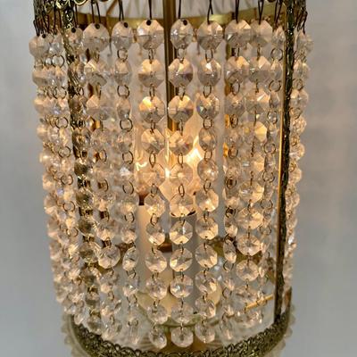 Sale Photo Thumbnail #330: Cast metal bronze-colored base with cherub playing a guitar. Chandelier-style crystal strands make up the shade for the three bulbs inside. Tested, works as expected.