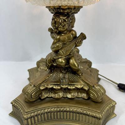 Sale Photo Thumbnail #328: Cast metal bronze-colored base with cherub playing a guitar. Chandelier-style crystal strands make up the shade for the three bulbs inside. Tested, works as expected.