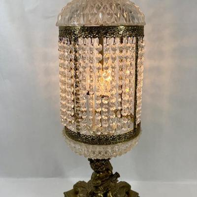 Sale Photo Thumbnail #327: Cast metal bronze-colored base with cherub playing a guitar. Chandelier-style crystal strands make up the shade for the three bulbs inside. Tested, works as expected.