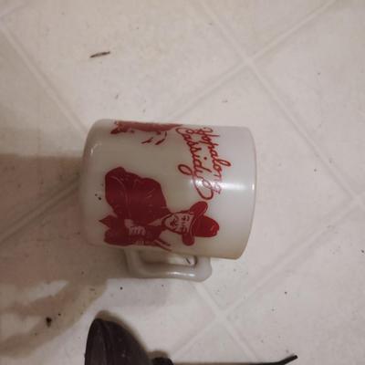 coffee mug and oil can