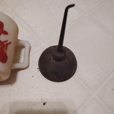 coffee mug and oil can