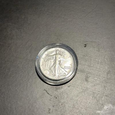 1928 SILVER STANDING LIBERTY QUARTER AND 1942 SILVER WALKING LIBERTY QUARTER