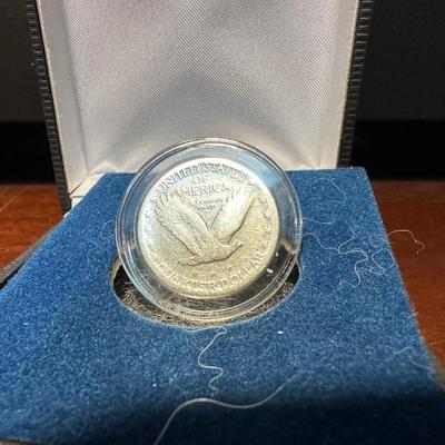 1928 SILVER STANDING LIBERTY QUARTER AND 1942 SILVER WALKING LIBERTY QUARTER