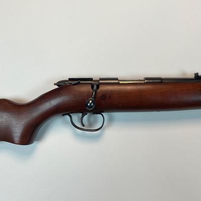 Sale Photo Thumbnail #26: Offered is a vintage Remington Model 512 The Sportmaster rimfire rifle — a classic mid-century bolt-action .22 with the original tubular magazine and traditional one-piece hardwood stock. The stamped barrel code LTT dates the barrel to Feb. 1948, placin