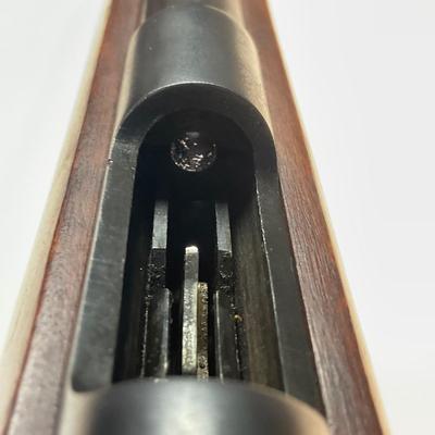 Sale Photo Thumbnail #46: Offered is a vintage Remington Model 512 The Sportmaster rimfire rifle — a classic mid-century bolt-action .22 with the original tubular magazine and traditional one-piece hardwood stock. The stamped barrel code LTT dates the barrel to Feb. 1948, placin