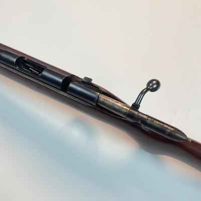 Sale Photo Thumbnail #42: Offered is a vintage Remington Model 512 The Sportmaster rimfire rifle — a classic mid-century bolt-action .22 with the original tubular magazine and traditional one-piece hardwood stock. The stamped barrel code LTT dates the barrel to Feb. 1948, placin