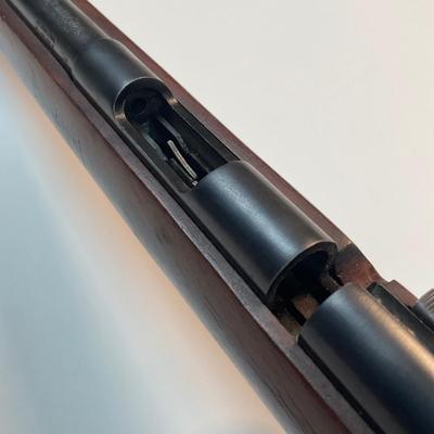 Sale Photo Thumbnail #43: Offered is a vintage Remington Model 512 The Sportmaster rimfire rifle — a classic mid-century bolt-action .22 with the original tubular magazine and traditional one-piece hardwood stock. The stamped barrel code LTT dates the barrel to Feb. 1948, placin