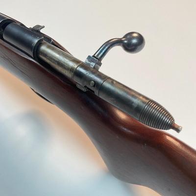 Sale Photo Thumbnail #44: Offered is a vintage Remington Model 512 The Sportmaster rimfire rifle — a classic mid-century bolt-action .22 with the original tubular magazine and traditional one-piece hardwood stock. The stamped barrel code LTT dates the barrel to Feb. 1948, placin