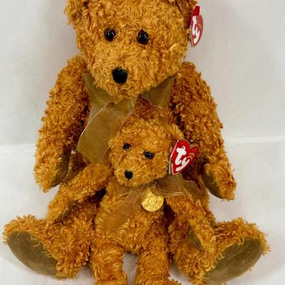 Sale Photo Thumbnail #102: Ty Classics Teddybearsary the Brown Bear, which was produced in 2002 to celebrate the 100th anniversary of the teddy bear.  It wears a gold mesh ribbon and a gold medallion around its neck. The medallion has a picture of a teddy bear with the dates 1902-2