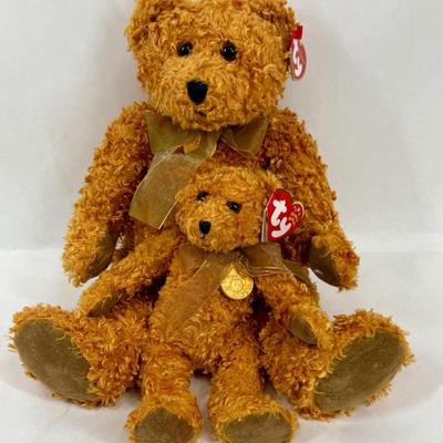Sale Photo Thumbnail #103: Ty Classics Teddybearsary the Brown Bear, which was produced in 2002 to celebrate the 100th anniversary of the teddy bear.  It wears a gold mesh ribbon and a gold medallion around its neck. The medallion has a picture of a teddy bear with the dates 1902-2