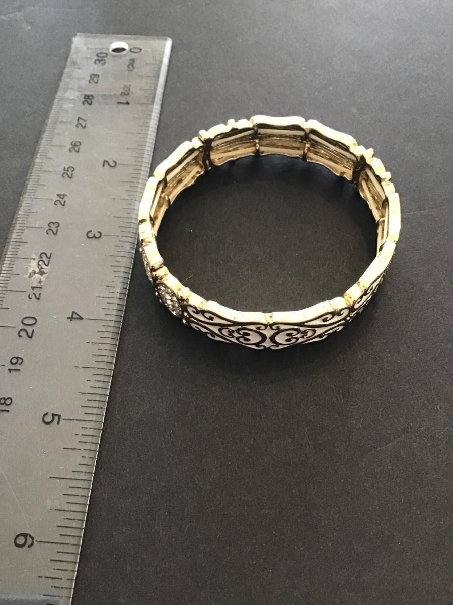 Sale Photo Thumbnail #189: Gold tone white enameled stretchy bracelet 
Please see attached photos