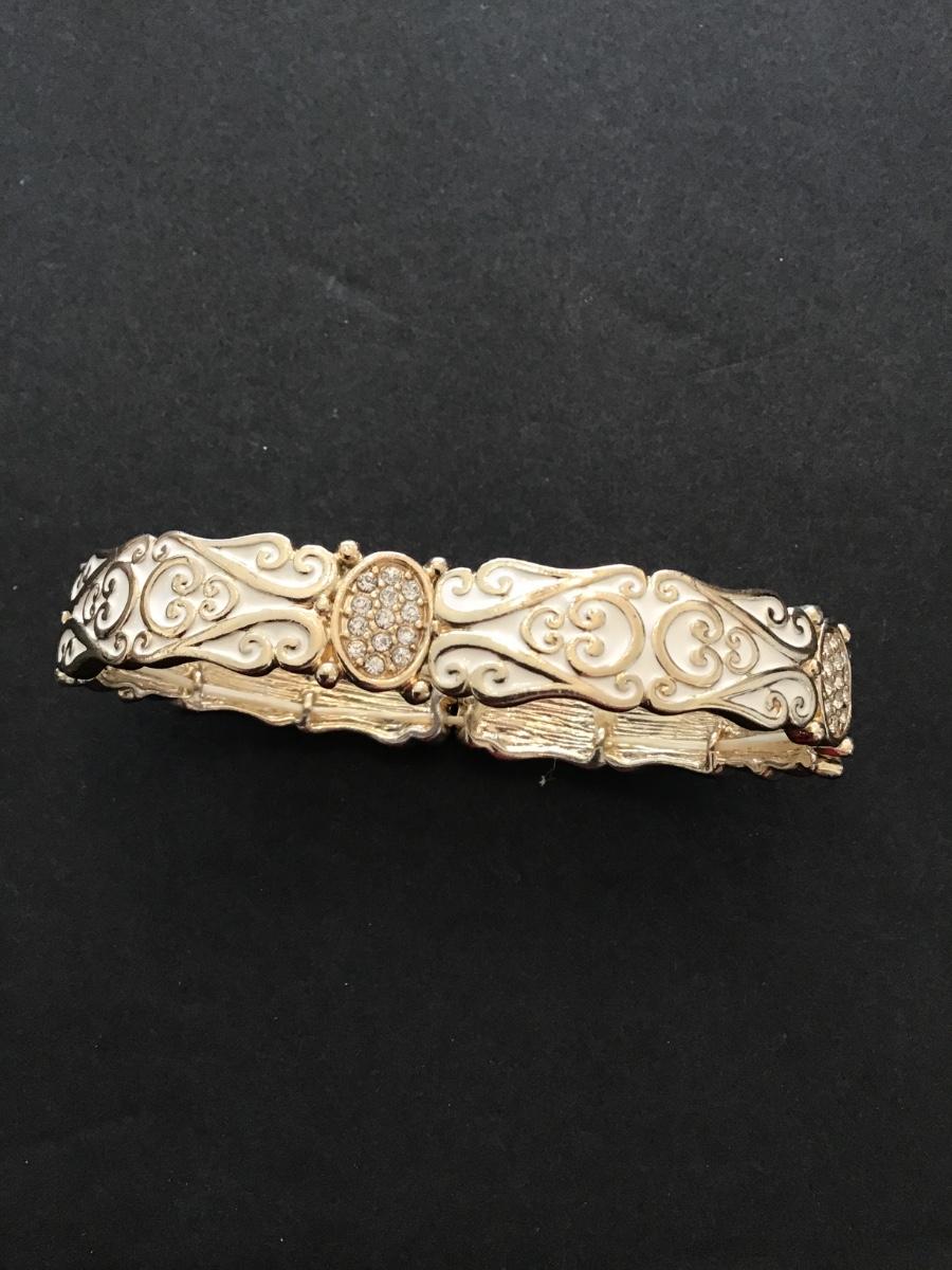 Sale Photo Thumbnail #190: Gold tone white enameled stretchy bracelet 
Please see attached photos