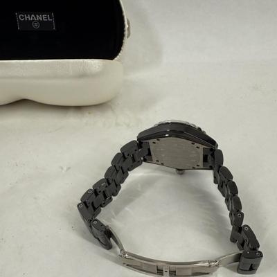 Sale Photo Thumbnail #368: In good used condition. Style is similar to the Chanel J12 Diver's watch, with rotating encrusted bezel.  Not working, may simply need a new battery.  Has a date window on the dial between the 4 & 5 position. Stored in a Chanel Sunglasses case.