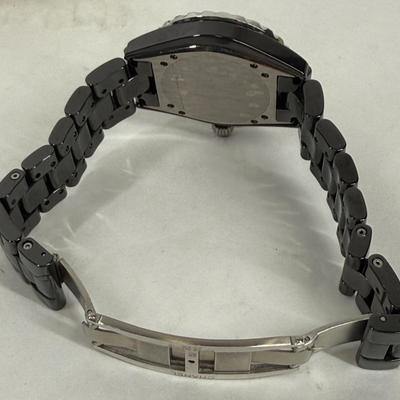 Sale Photo Thumbnail #367: In good used condition. Style is similar to the Chanel J12 Diver's watch, with rotating encrusted bezel.  Not working, may simply need a new battery.  Has a date window on the dial between the 4 & 5 position. Stored in a Chanel Sunglasses case.