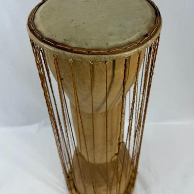 Sale Photo Thumbnail #392: 2 heads and leather tension cords. Player holds the drum under their arms and squeezes the cords to change the pitch, mimicking the. tones of human speech. In good used condition.