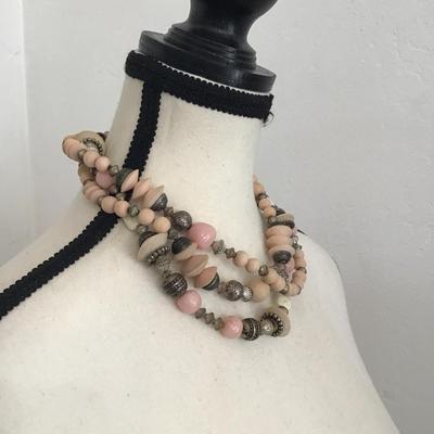 Beautiful, multi strand beaded necklace with pink and cream and silver tone beads