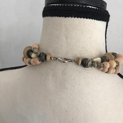 Beautiful, multi strand beaded necklace with pink and cream and silver tone beads