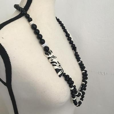 Beautiful, black and white faux beaded necklace with zebra pendant
