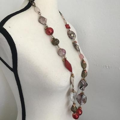 Very nice long beaded statement, necklace with a mix of red pink and gray beads various pendants