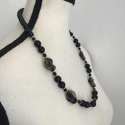 Beautiful vintage, black faceted graduated French glass necklace with gold tone spacers