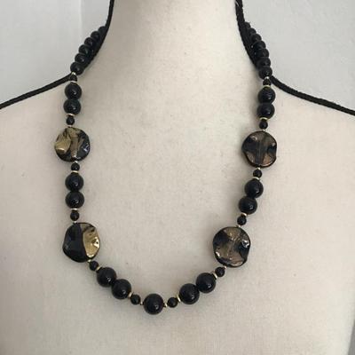 Beautiful vintage, black faceted graduated French glass necklace with gold tone spacers