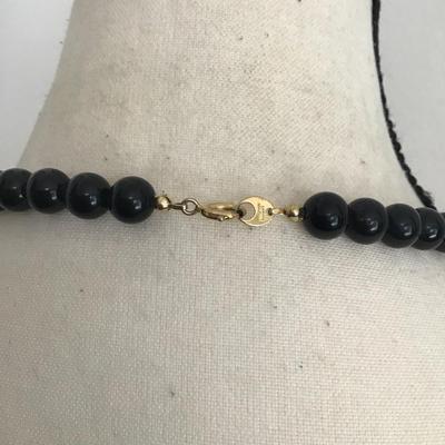 Beautiful vintage, black faceted graduated French glass necklace with gold tone spacers