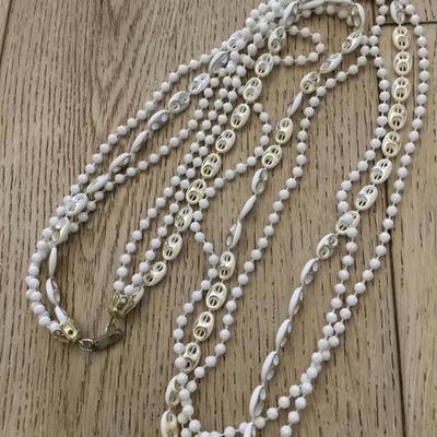 Beautiful, vintage white and gold tone Multi strand, bead, flapper style necklace
