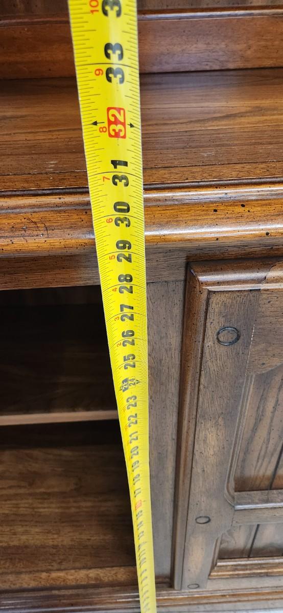 Sale Photo Thumbnail #37: Solid wood china hutch with a single light and single glass shelf in the top piece. 2 pieces but bring help to load