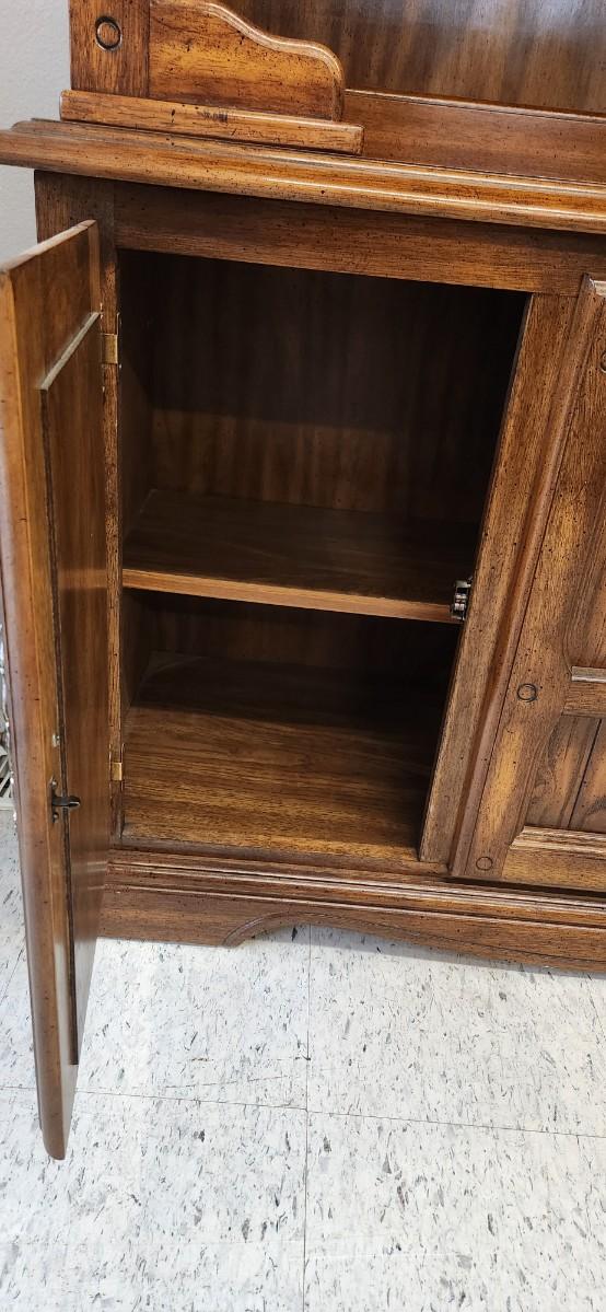 Sale Photo Thumbnail #34: Solid wood china hutch with a single light and single glass shelf in the top piece. 2 pieces but bring help to load