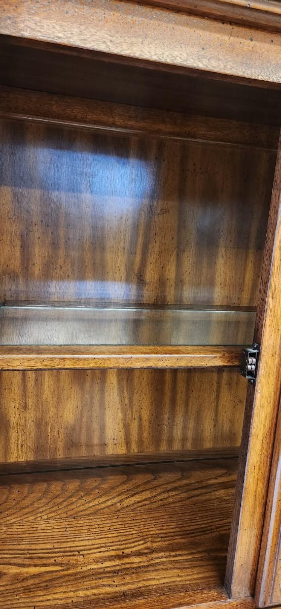 Sale Photo Thumbnail #33: Solid wood china hutch with a single light and single glass shelf in the top piece. 2 pieces but bring help to load
