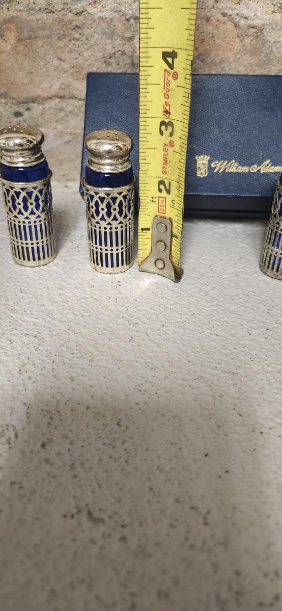 Sale Photo Thumbnail #51: Beautiful set of 4 cobalt glass shakers with silver casing and tops. Still have the original box