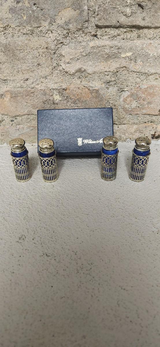 Sale Photo Thumbnail #50: Beautiful set of 4 cobalt glass shakers with silver casing and tops. Still have the original box