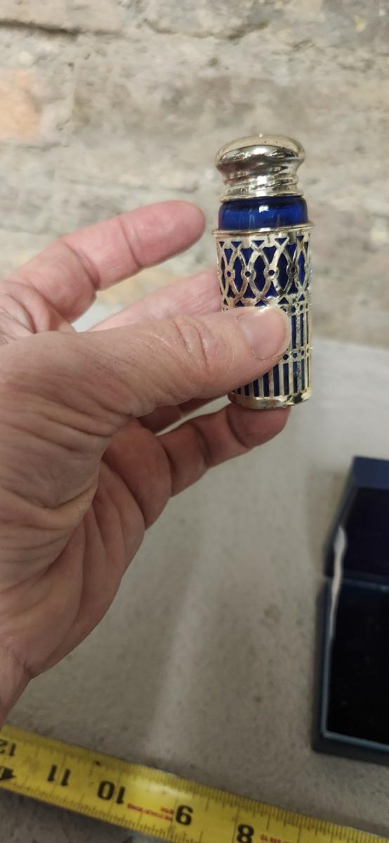 Sale Photo Thumbnail #53: Beautiful set of 4 cobalt glass shakers with silver casing and tops. Still have the original box