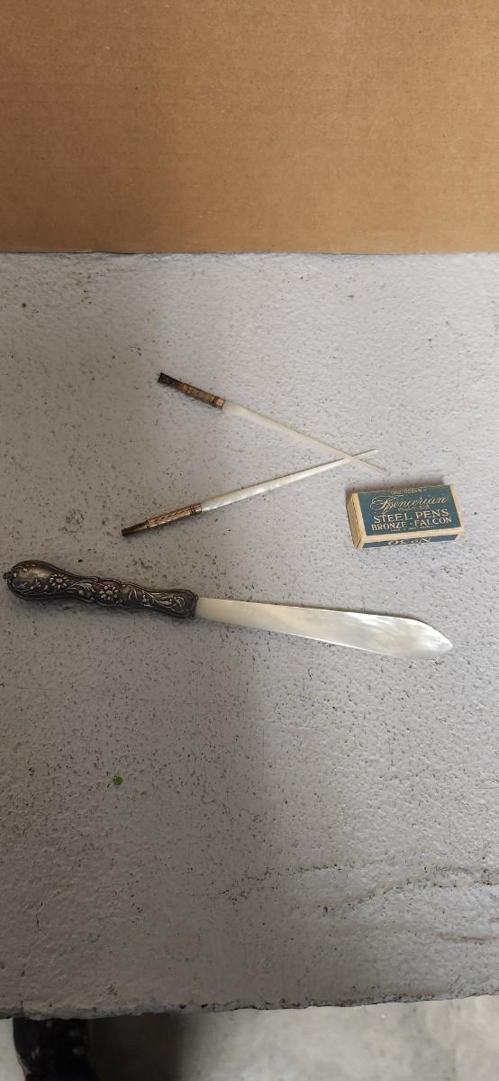Sale Photo Thumbnail #131: Pair of ladies writing pens that are mother of pearl and gold. MoP letter opener with silver handle.