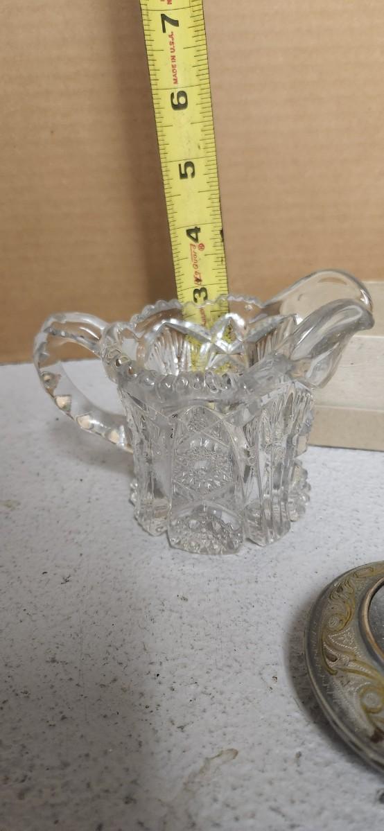 Sale Photo Thumbnail #140: Gorgeous little Baccarat finger bowl, cranberry glass small vase, pair of Waldonia crystal candlesticks and a few other things.