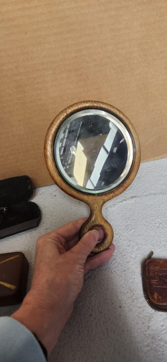Sale Photo Thumbnail #162: Antique glasses, razors, curling iron, mirror....one of those razors have ivory on one side and what looks like tusk (?) on the other.