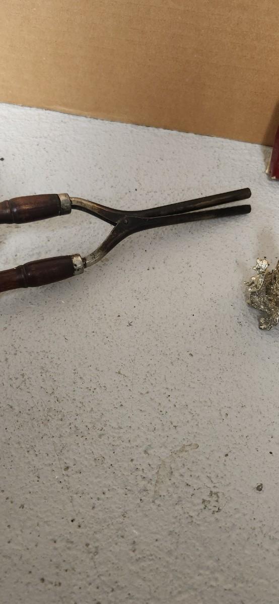 Sale Photo Thumbnail #151: Antique glasses, razors, curling iron, mirror....one of those razors have ivory on one side and what looks like tusk (?) on the other.