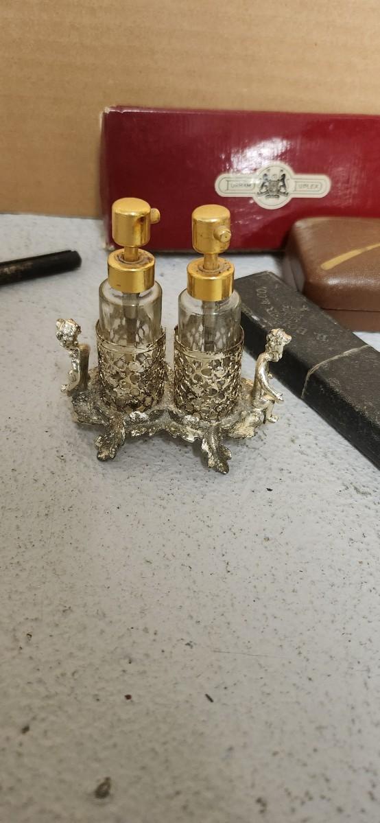 Sale Photo Thumbnail #152: Antique glasses, razors, curling iron, mirror....one of those razors have ivory on one side and what looks like tusk (?) on the other.