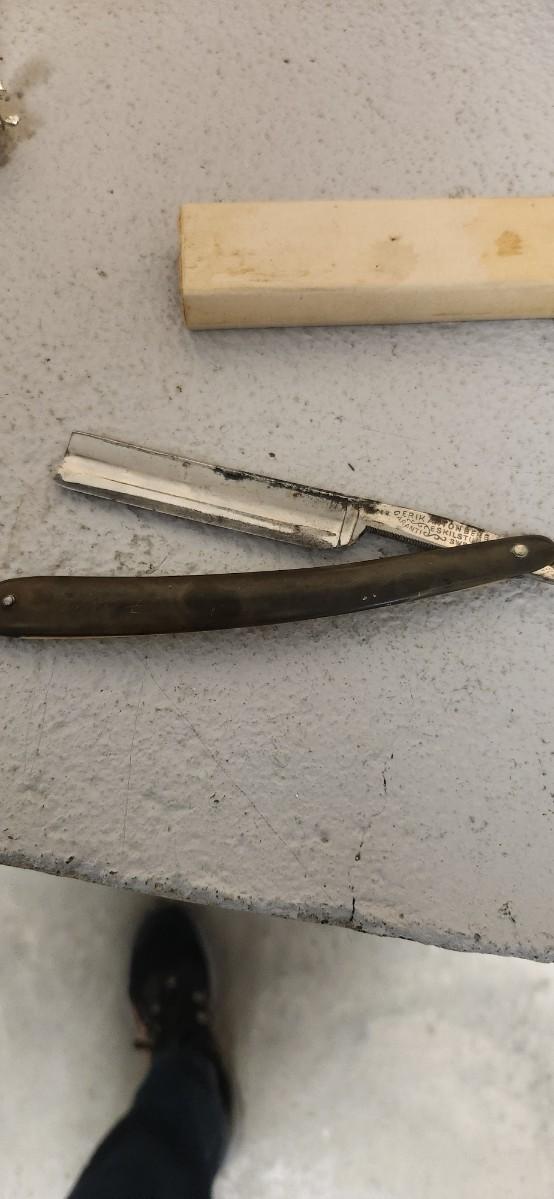 Sale Photo Thumbnail #155: Antique glasses, razors, curling iron, mirror....one of those razors have ivory on one side and what looks like tusk (?) on the other.